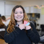 A student from 
Bay City Western Middle School in Michigan showcases her Brag Tags